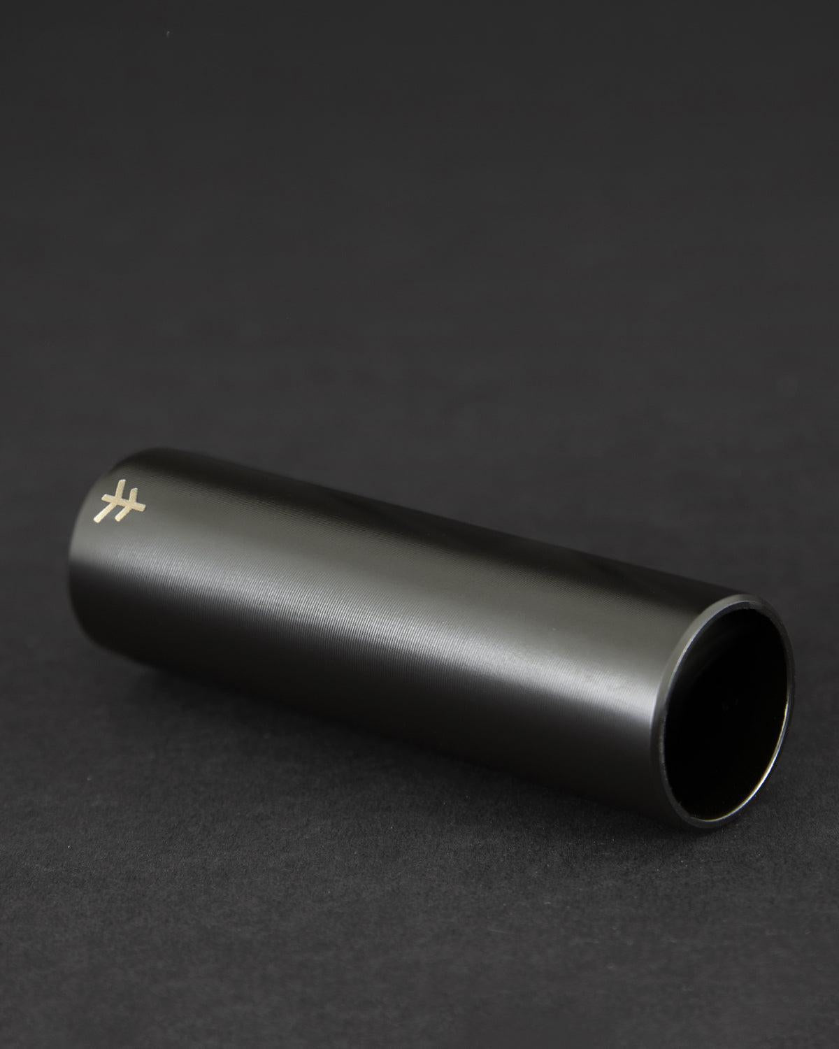 A black, cylindrical Fly Bikes Acero ST Peg with a subtle logo at one end, CNC Machined from 4140 Cr-Mo for durability, sits against a dark background.