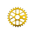 The Mission Nexus Sprocket BMX sprocket, featuring 25 teeth, multiple cutouts, and a gold finish, is crafted from tough 6061 aluminum and displayed on a white background.
