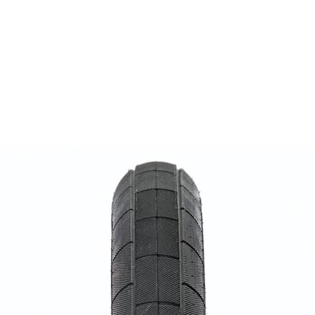 A close-up of a Demolition Momentum Tyre wire bead tire.