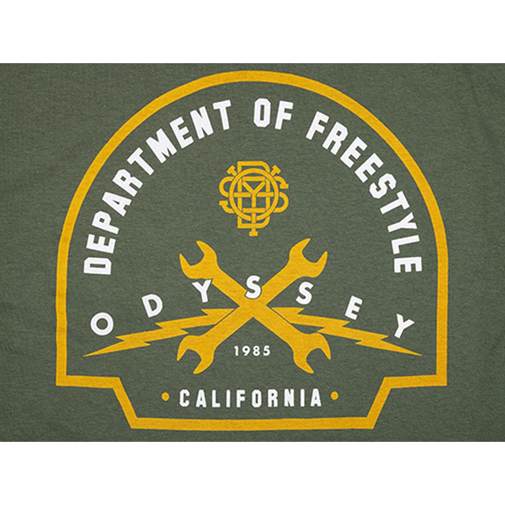 The Odyssey Service T-Shirt boasts a green graphic design featuring the text "Department of Freestyle," "Odyssey 1985," and "California." It also includes yellow wrenches crossed over lightning bolts and an emblem at the top, giving it the look of a freestyle department uniform.