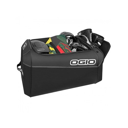 The Ogio Gear Bag, also known as the Prospect Stealth, is a durable black sports bag made from heavy-duty fabric. It carries diverse equipment like helmets and protective gear while being environmentally friendly with its eco-friendly PVC material.
