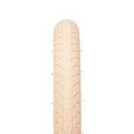 A beige Eclat Optima Tyre is displayed top-down on a white background, clearly showing its all-terrain tread and texture.