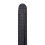 A close-up of the Eclat Optima Tyre in black, featuring an all-terrain tread pattern, is shown from above on a white background.