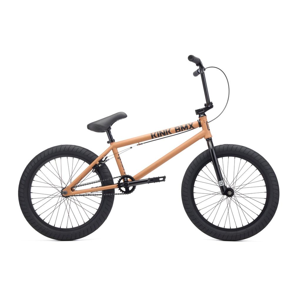 The Kink Steup 20 Inch Bike (2027), a tan beginner BMX with a strong Chromoly frame, black tires, handlebars, and seat, is displayed in side view against a white background.