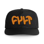 The Cult Logo Cap Orange is a black snapback with "FULT" in bold orange bubble letters on the front, crafted from lightweight nylon for comfortable all-day wear.