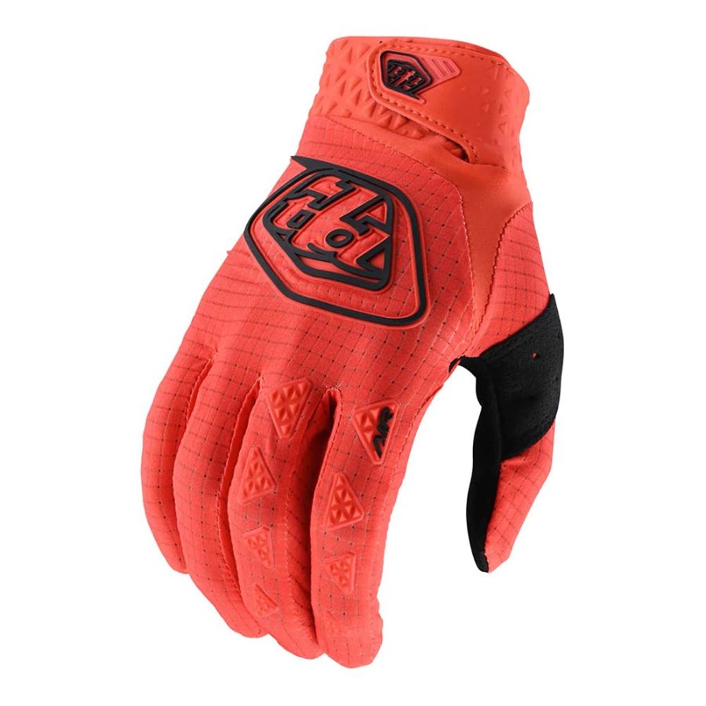 Sentence with the product name: TLD Air Glove Orange with single-layer perforated palm, red motocross glove with black accents and protective padding.