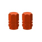 The Hexagon Valve Caps, shown in vibrant orange against a plain white background, add a splash of color to your ride.