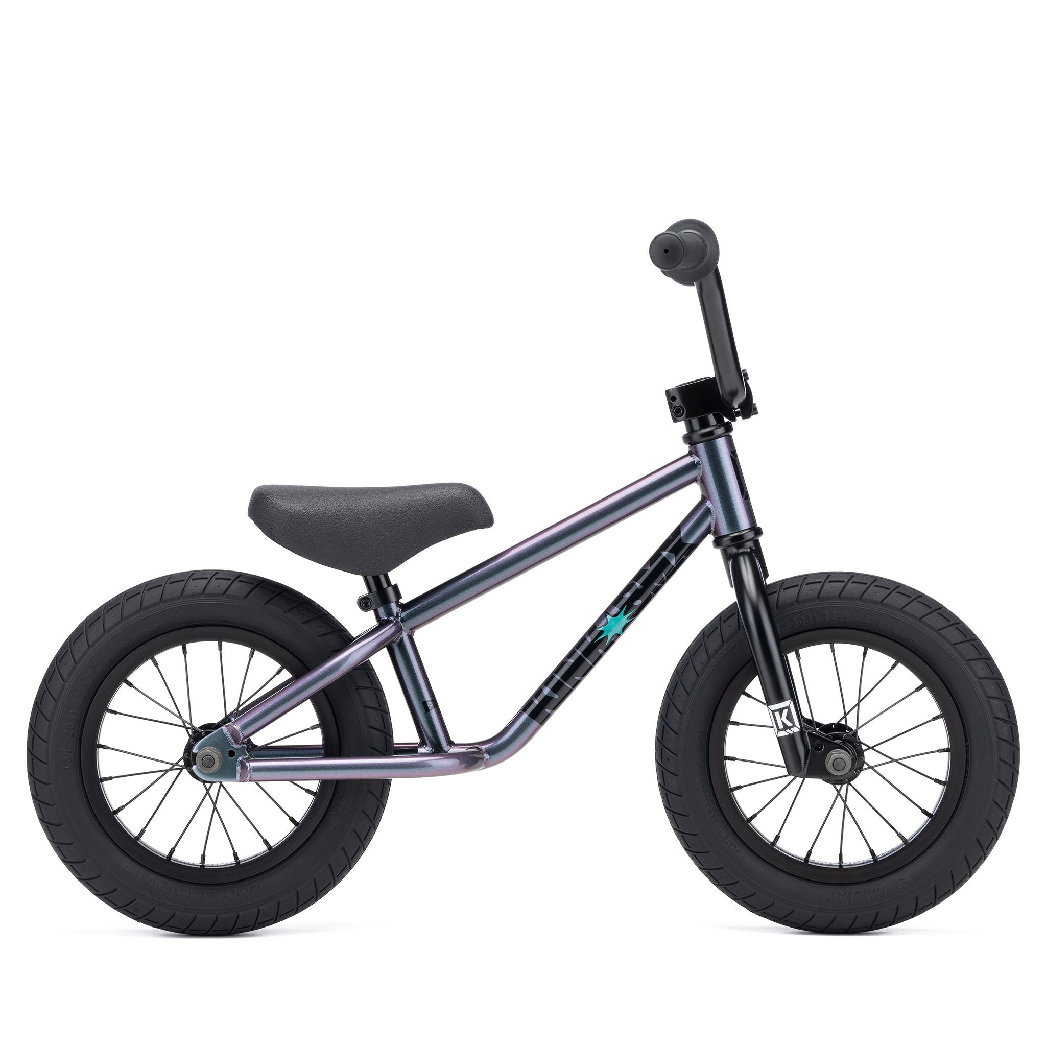 The Kink Coast 12 Inch Balance Bike (2026) features a sleek dark metallic frame and sturdy black wheels, set against a clean white background. It's the perfect introduction to biking for budding BMX enthusiasts.