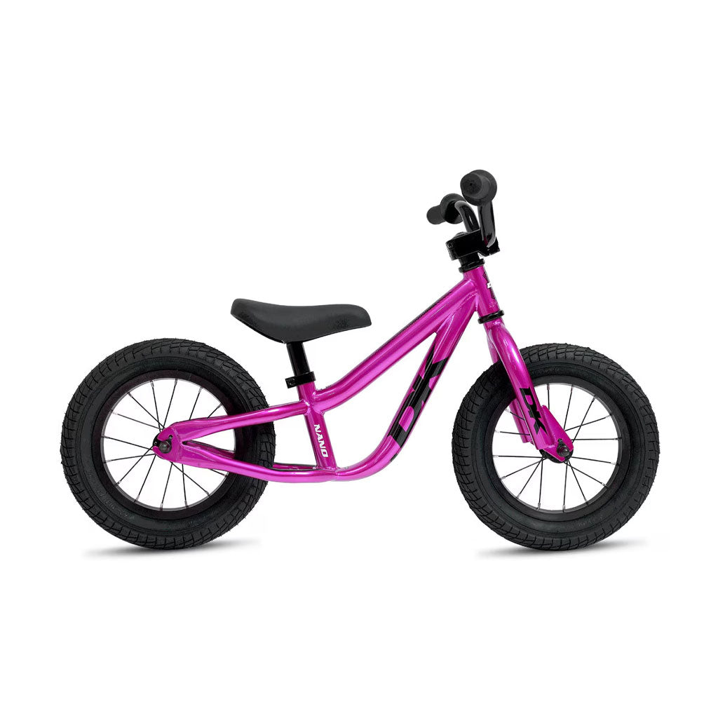The DK Nano Balance Bike is a small, purple kids’ balance bike featuring black tires, handlebars, and seat—perfect for young children learning to ride.