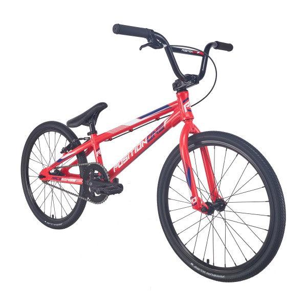 A durable red Position One Expert Bike (2024) on a white background.