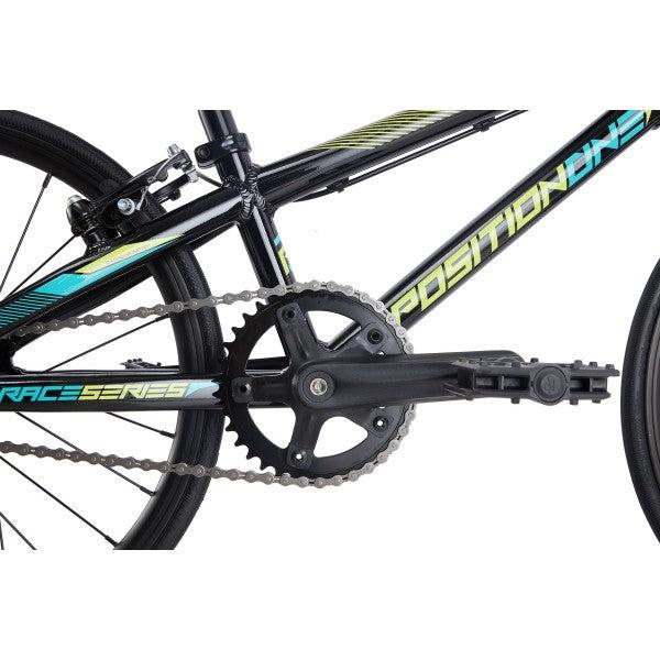 A black Position One Junior Bike (2024) with an all-aluminium frame is shown against a white background.