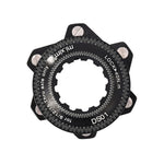 A close-up view of a black and silver bicycle rotor lockring labeled "DS01" with specifications indicated around the edge, seamlessly integrating the Position One Centerlock ISO Adapter Kit for enhanced compatibility.
