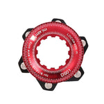A red bicycle chainring with a POSITION ONE ISO CENTER LOCK DISC ADAPTER.