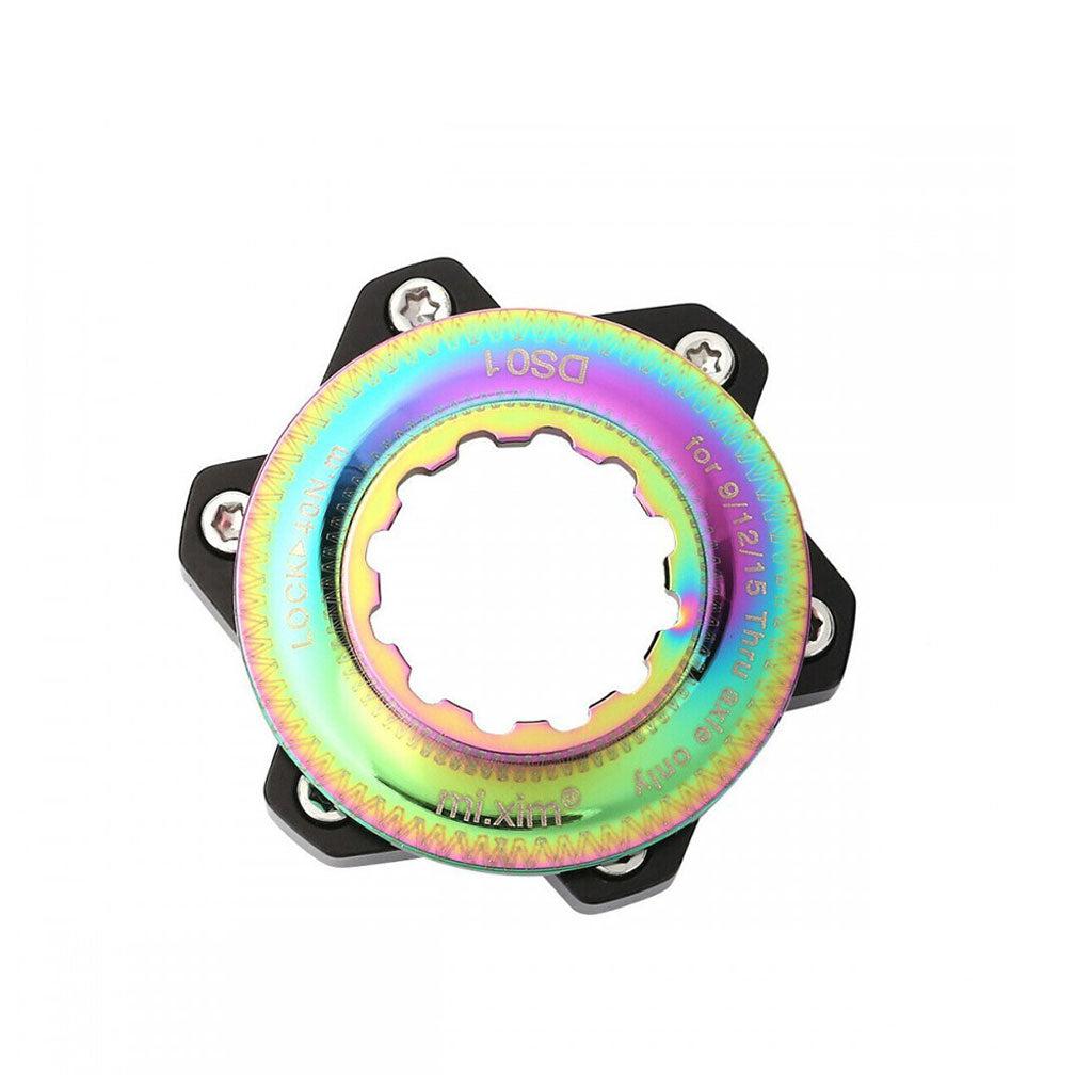 The Position One Centerlock ISO Adapter Kit is a vibrant metallic bicycle disc brake rotor adapter, compatible with 6 Bolt Rotors and Center Lock Adapter systems, featuring multiple attachment points and labeled text.