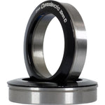 A black and stainless steel Praxis M30 THRU BB86/90/92 bearing ring on a white background.