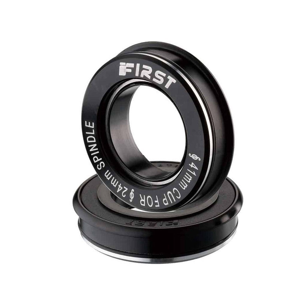 A lightweight black First BB86 Press Fit Alloy Cup Bottom Bracket bearing with the word first on it.