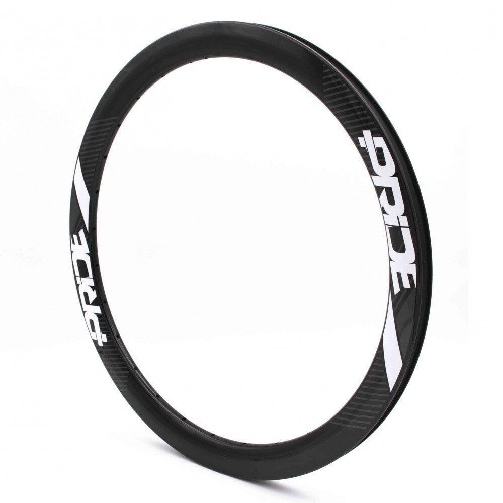 Explore the Pride Carbon Gravity EXP Aero Rim 28H UD (451mm), a black and white rim with "PRIDE" branding, designed for BMX racing. These carbon rims combine sleek aerodynamic design with seamless performance and style.