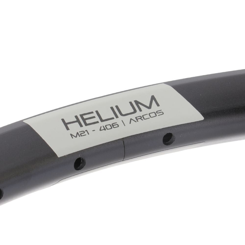 Close-up of a lightweight bicycle rim labeled "PRIDE Helium M21 - 406 / ARCOS Brakeless Expert Rim" with two spoke holes visible, featuring an aluminum rim perfect for a disc setup.