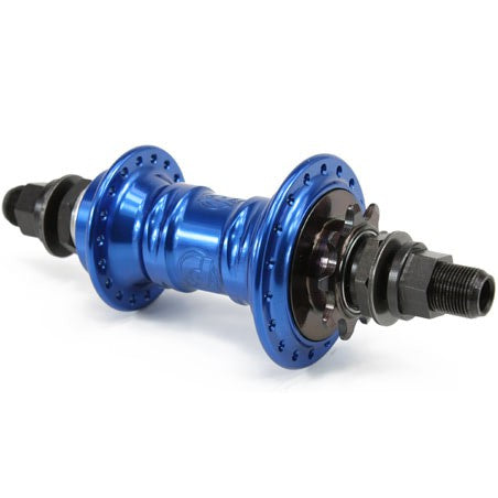 Introducing the Profile Mini Rear Cassette Hub: a sleek blue BMX component with a low-flange design, equipped with multiple gears and essential mounting hardware.