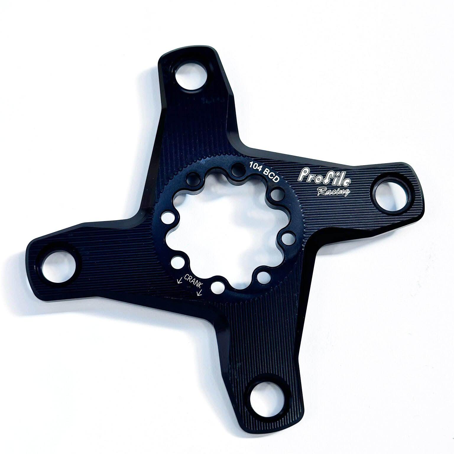 The Profile Spider 4 Bolt 104PCD 30mm is a black, four-arm spider for Profile Elite AL cranks with a 30mm spindle and multiple bolt holes, shown on a white background.