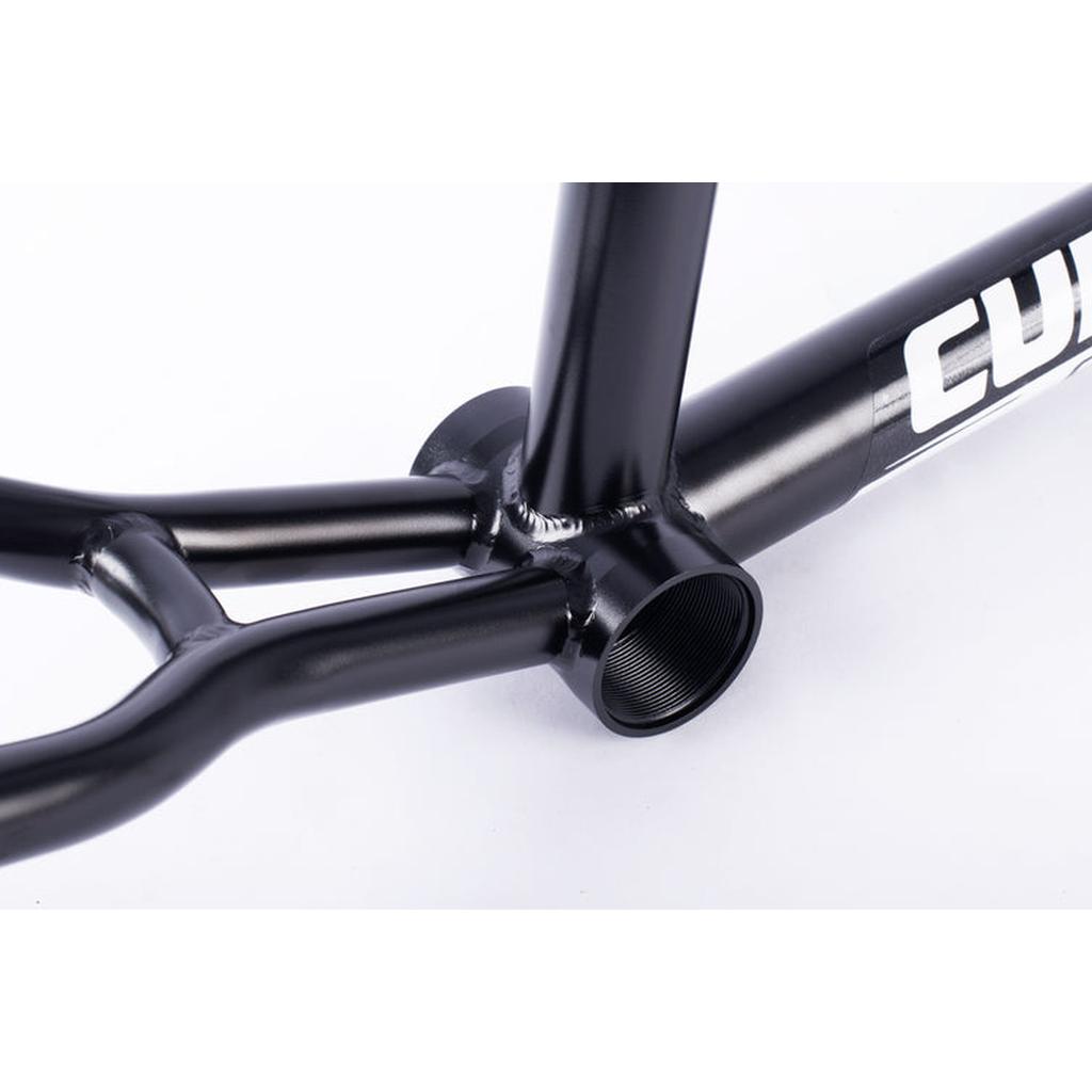 Close-up of a black Cult Race Disc Frame / Pro XL, highlighting the bottom bracket shell with visible threads and part of the chainstays.