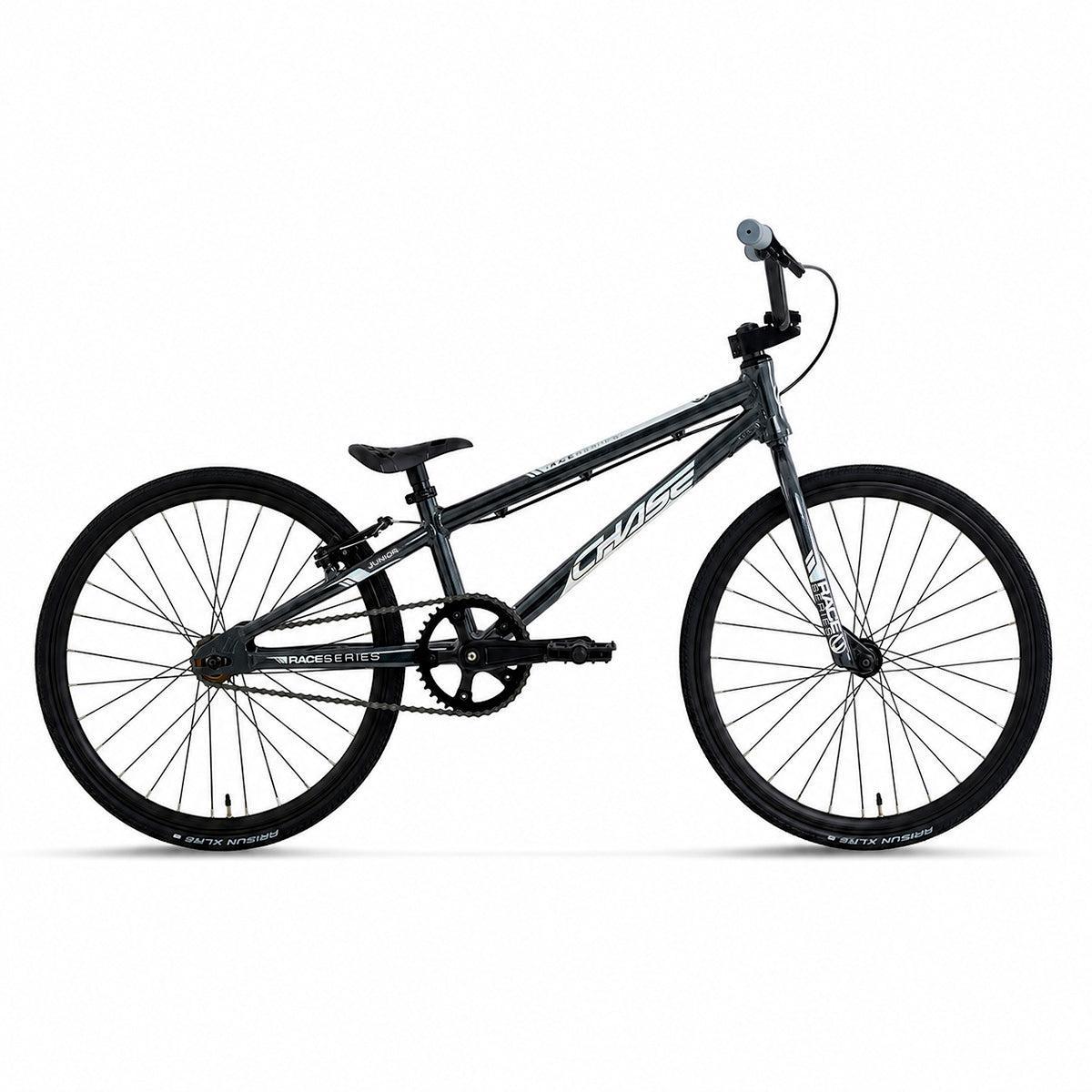 Chase Race Series Junior Race Bike (2027) shown from the side on a plain white background, featuring a black BMX design with thin tires, a lightweight frame, single gear, and flat handlebars.