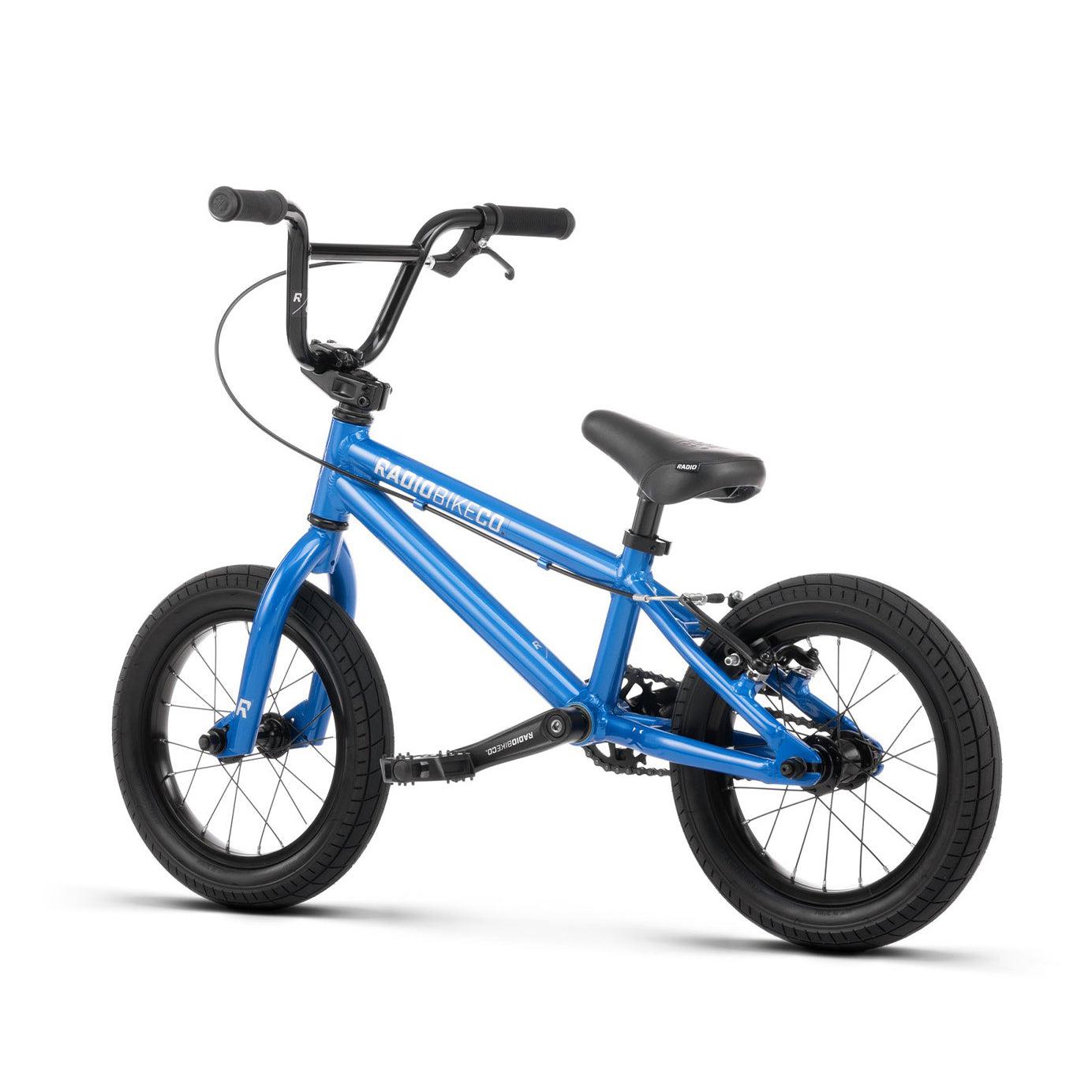 A lightweight kids bike, the Radio Dice 14 Inch Bike features training wheels, black handlebars, and black tires. Its durable 6061-T6 alloy frame proudly displays "RADIO BIKES" in white lettering.