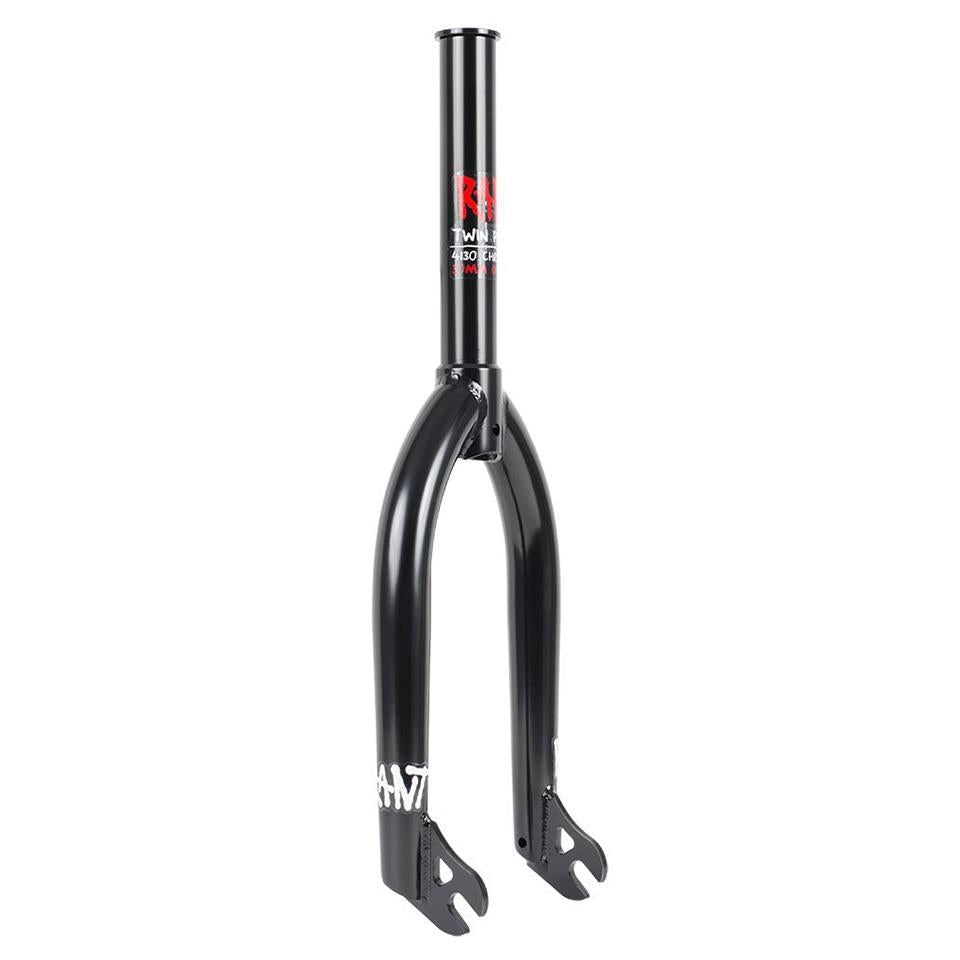 The Rant Twin Peaks 18 Inch Forks are black BMX bike forks with a red logo and white text, crafted from 4130 Chromoly. They feature two prongs and a central tubular section.