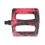 Odyssey Twisted PC Pro Pedals in a red and black marbled finish feature two large openings, a high-strength nylon composite body, and a durable chromoly spindle for secure attachment.