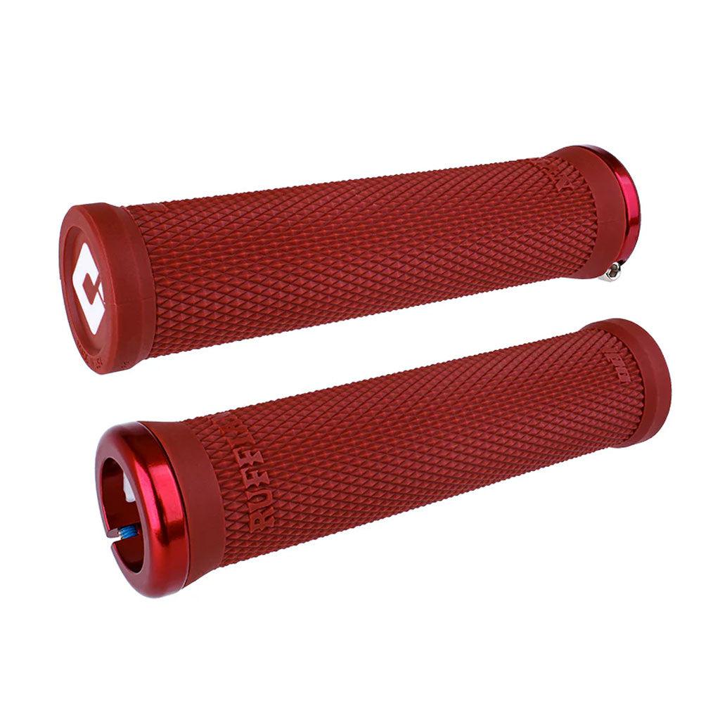 A pair of ODI BMX RUFFIAN V2.1 LOCK ON GRIP 135MM in red, made from Soft Compound TPE, featuring textured surfaces and metallic ends.