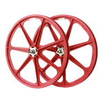 A pair of red Skyway Tuff II Rivet 24 Inch Wheelset on a white background.