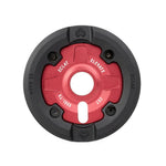 A close-up of the Eclat Elevate Guard Sprocket in red and black, featuring a nylon fiberglass guard and showcasing detailed etchings on its surface.