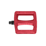 The Odyssey Twisted PC Pro Pedals feature a red rectangular shape with two wide openings, "Odyssey" imprinted in the center, a durable nylon composite body, and a black metal spindle—ideal for any BMX bike.