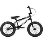 Side view of the Raven Trickster 16 Inch Bike in black, featuring "RAVEN" and "TRACKSTER" on the frame, thick tires, and a straight handlebar—ideal as a kids BMX bike.