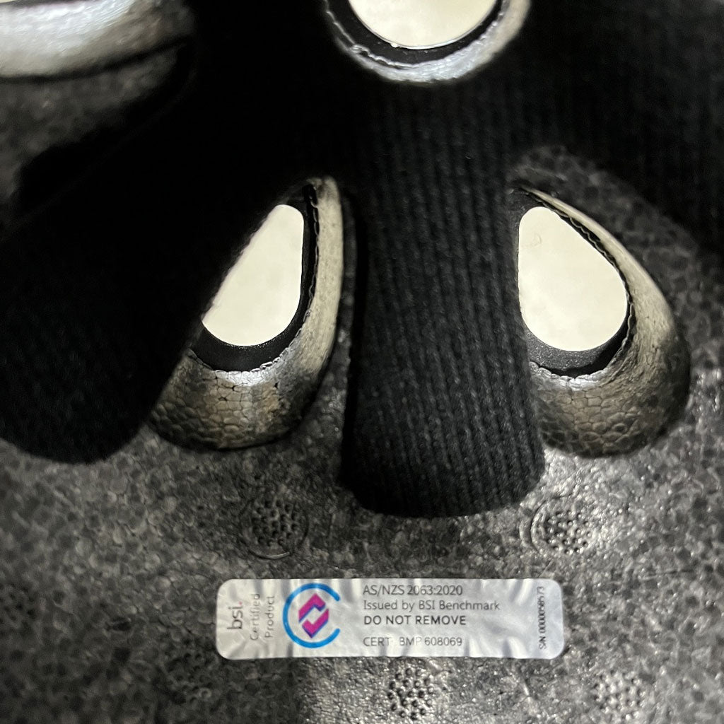 A close up of a certified S-One Helmet Lifer Black Matte/Pink Straps.
