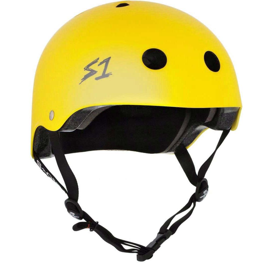 The S-One Helmet Lifer in Yellow Matte comes with black chin straps and circular ventilation holes. Its EPS Fusion Foam offers certified multiple impact protection, combining style with safety.