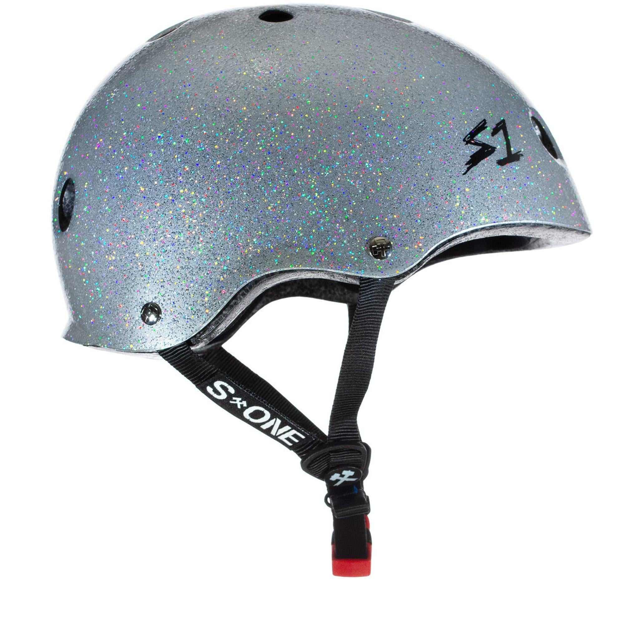 A sparkly silver S-One Helmet Mini Lifer Silver Gloss Glitter with black straps and a red buckle, featuring the "S-ONE" logo on the adjustable chin strap and the "S1" logo on the side. This multi-impact helmet is equipped with EPS Fusion Foam for superior protection.