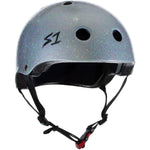 A S-One Helmet Mini Lifer Silver Gloss Glitter with a black interior padding, featuring the logo "S1". It incorporates EPS Fusion Foam for multi-impact protection, multiple ventilation holes, and an adjustable chin strap with a red buckle.