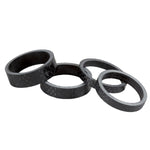Four Salt Headset Carbon Fibre Spacer Set of varying thicknesses displayed against a white background.