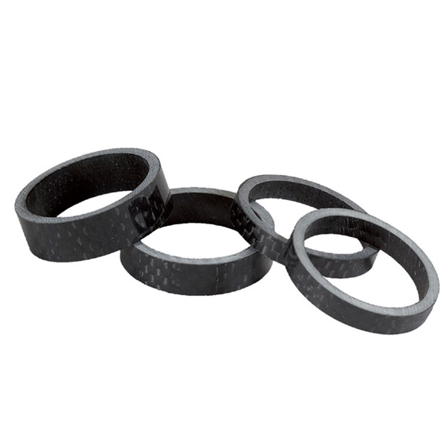 Four Salt Headset Carbon Fibre Spacer Set of varying thicknesses displayed against a white background.