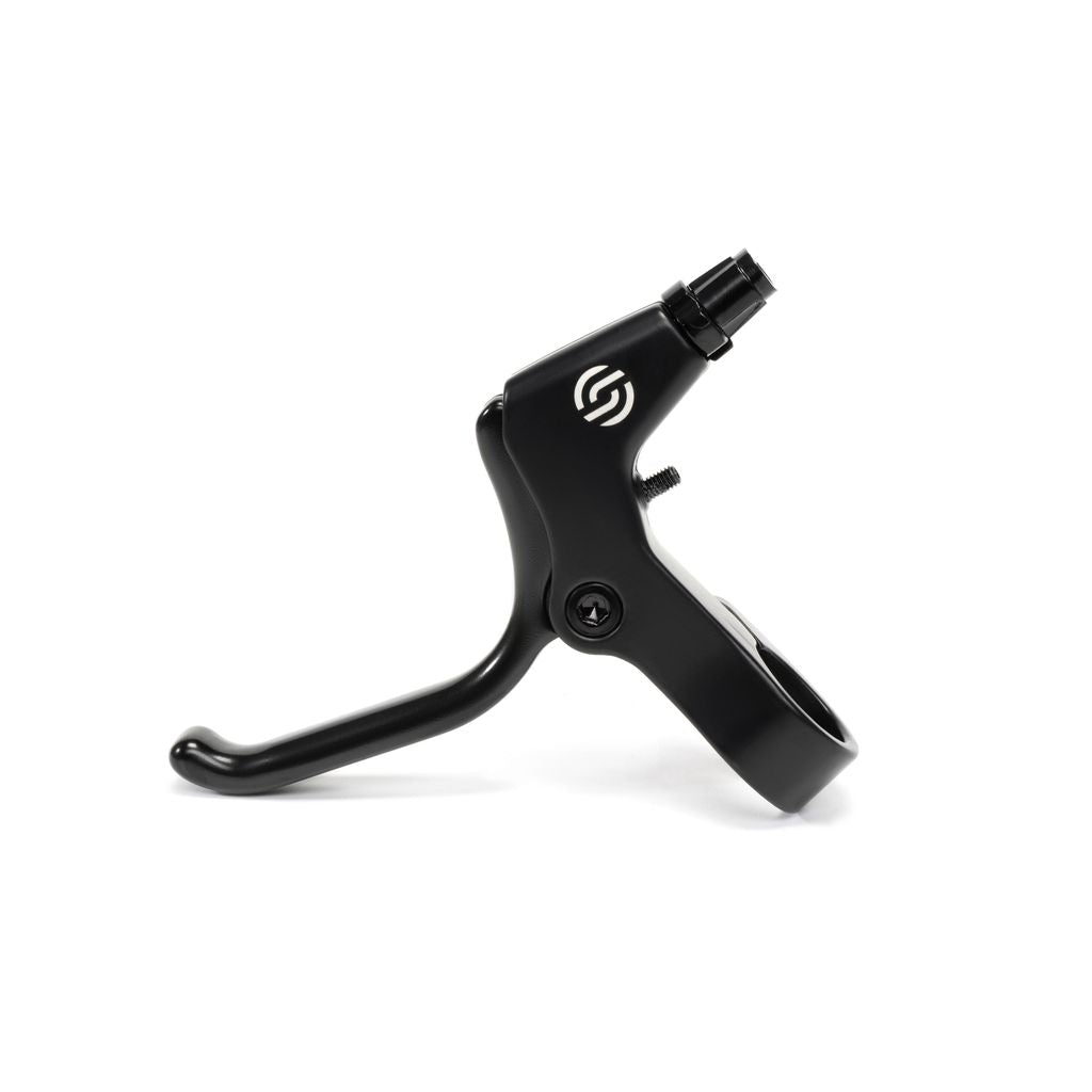 Close-up of a black Salt Kids V2 U-Brake Lever with a logo. The lever is positioned horizontally, showing the mounting mechanism and a small adjustment screw.