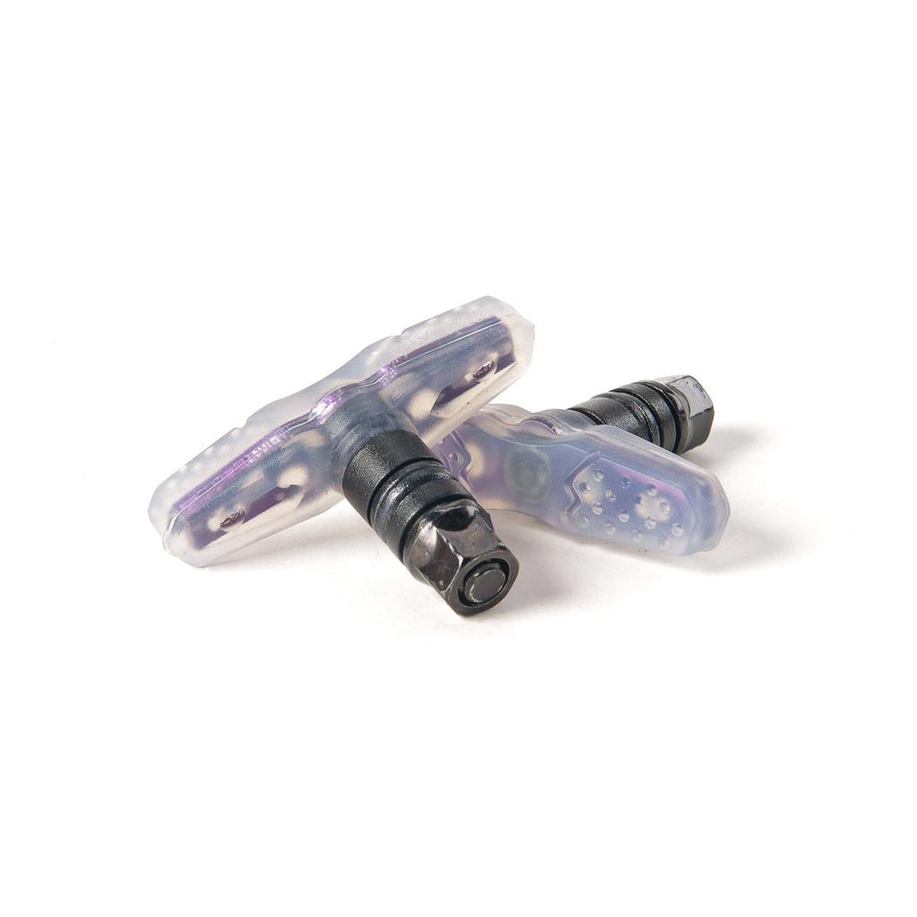 The Salt Propeller Brake Pads, a pair of translucent brake pads with metal attachment bolts, are shown on a white background and feature a soft rubber compound for top performance on black and colored rims.