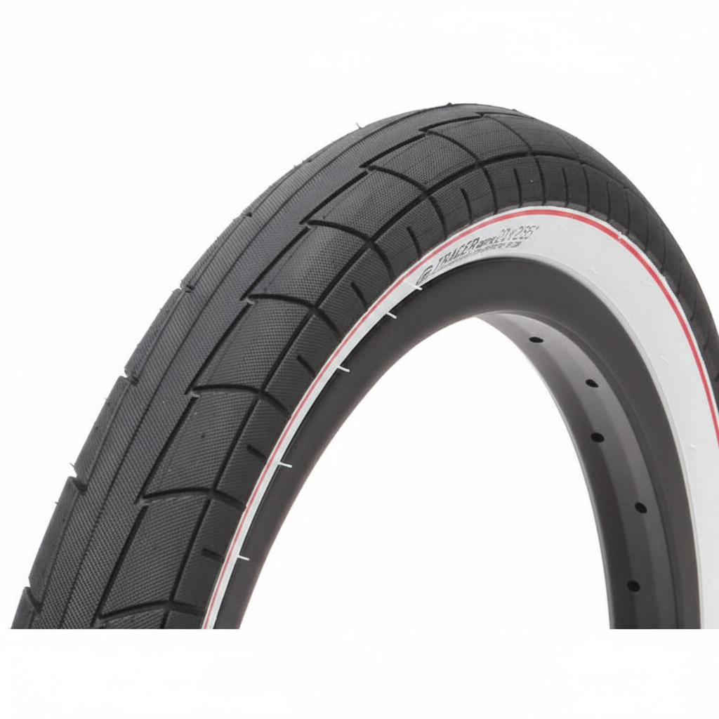 Close-up of the Salt Tracer 20 Inch Tyre (Each) in black with a white sidewall, showing its tread pattern and part of a metal rim—an affordable BMX tyre replacement.