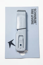 A package of Schwalbe Tire Levers, consisting of two blue plastic levers stacked together on a branded backing card—an essential tool for effortless bicycle tire removal.