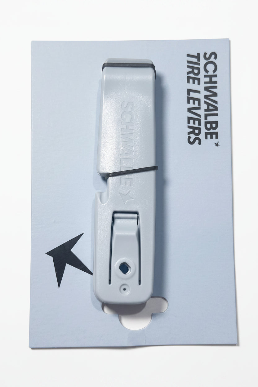 A package of Schwalbe Tire Levers, consisting of two blue plastic levers stacked together on a branded backing card—an essential tool for effortless bicycle tire removal.