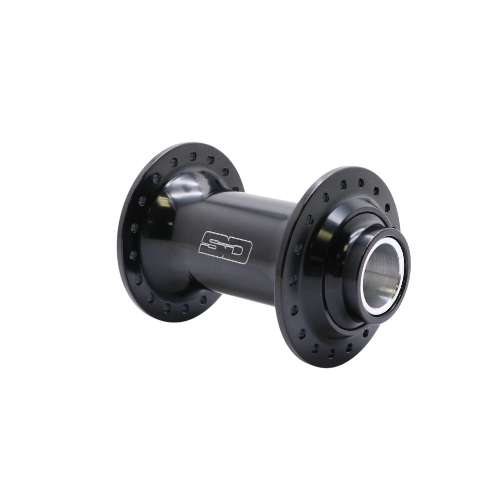 The SD Ace Pro Thru-Bolt Hub Front is a black anodized hub featuring multiple spoke holes, metallic accents, and sealed cartridge bearings. CNC machined from aluminum, it is elegantly displayed against a white background.