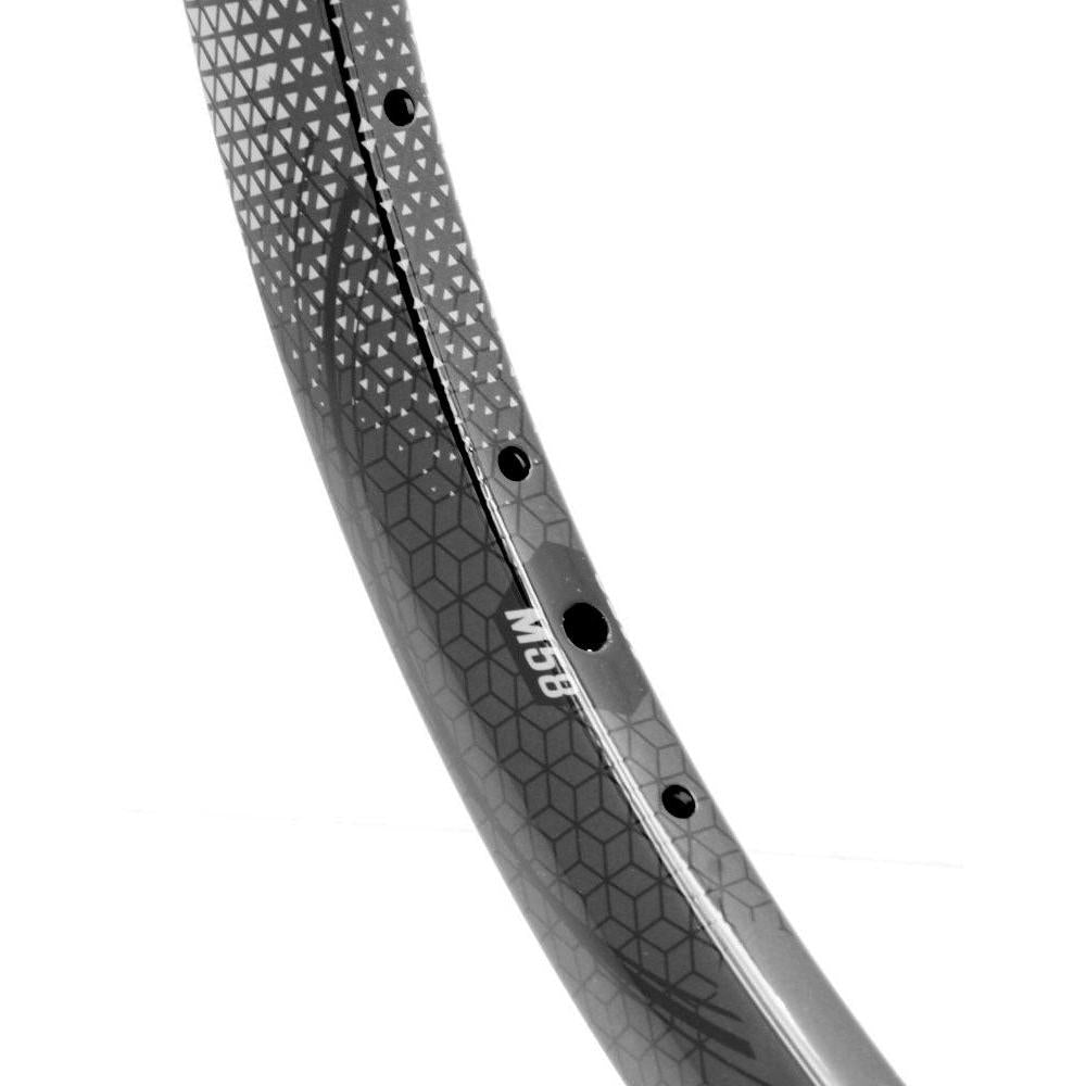 Close-up of the high-performance black bicycle rim with a geometric pattern, labeled M30. Inspired by Meybo HSX elements, this rim offers advanced durability and style similar to the SD-X M58 V2 Carbon Race Rim Brakeless.