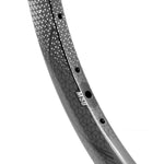 Close-up of the high-performance black bicycle rim with a geometric pattern, labeled M30. Inspired by Meybo HSX elements, this rim offers advanced durability and style similar to the SD-X M58 V2 Carbon Race Rim Brakeless.
