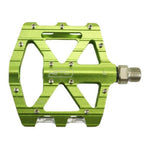 The SD CNC V2 Junior/Expert Pedals feature a green CNC alloy body, wide flat platform, multiple grip pins, precision sealed bearings, and a threaded axle for secure attachment.