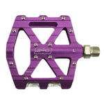 The SD CNC V2 Junior/Expert Pedals are purple metal alloy pedals with an open geometric design, silver axle, precision sealed bearings, small metal grip pins, and “SD” engraved in the center.